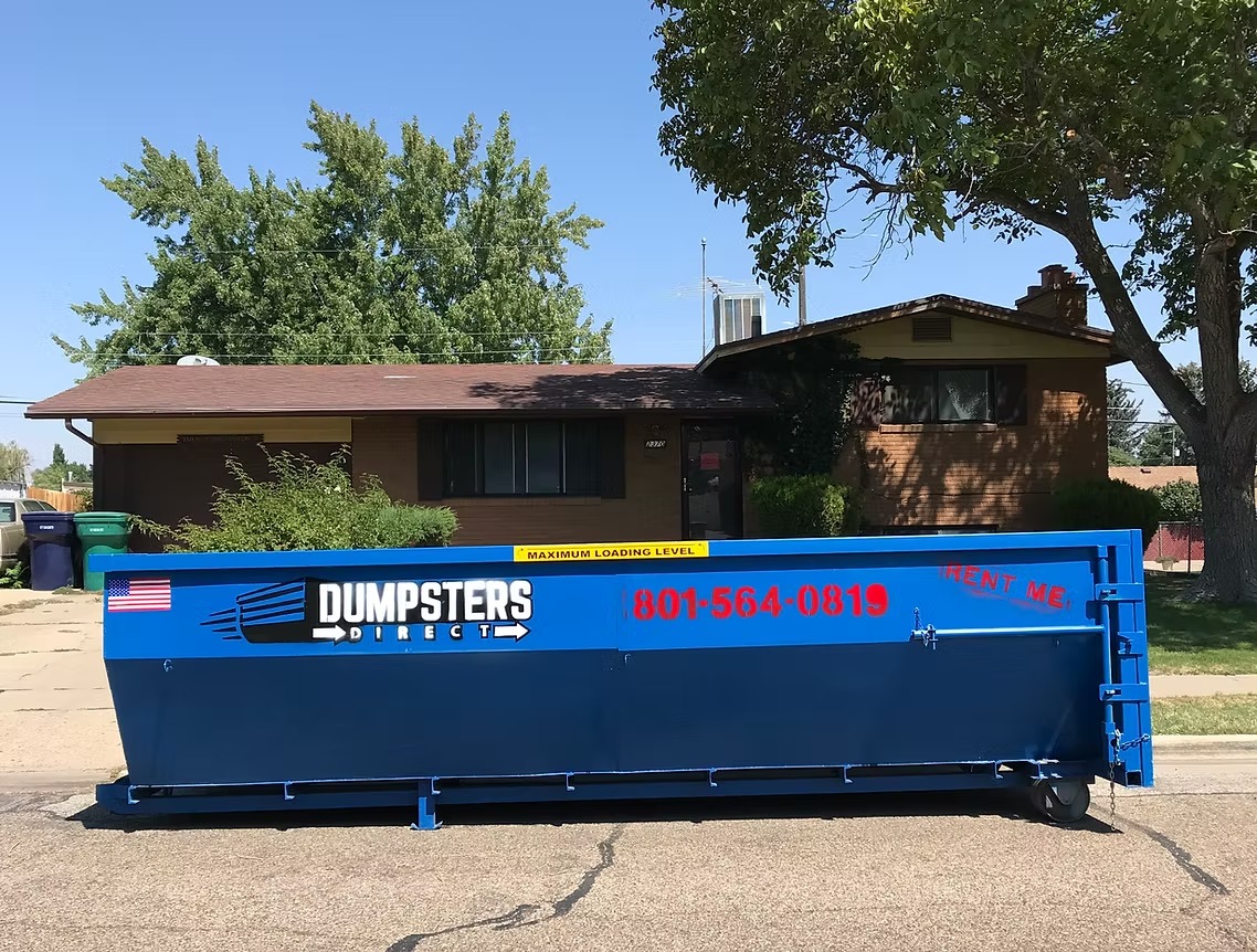 15 yard Dumpsters Direct roll off dumpster in front of a home
